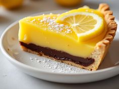 a slice of lemon pie on a white plate