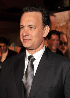 a man in a suit and tie at an event