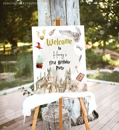 an easel with a welcome sign on it sitting in front of a wooden deck