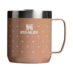 the stanley coffee mug is shown in tan and has an image of a dog on it