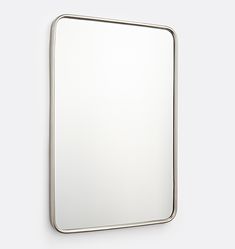 a square mirror hanging on the wall