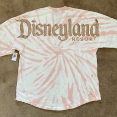 Disneyland Resort Rose Gold Pink Tie Dye Spirit Jersey. New With Tags Never Worn No Damages. Relaxed Fit. Long Sleeve Round Neck. Rose Gold Pink Tie Dye Printed Body With Rose Gold Glitter Raised Lettering. Size Xs. 100% Cotton Machine Wash Cold. Purchased At Disneyland Resort. Tie Dye Disney, Pastel Tie Dye, Spirit Jersey, Disney Tees, Paris Woman, Thermal Shirt, Rose Gold Pink, Tie Dye Long Sleeve, Pink Tie