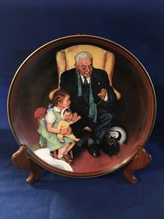 an old man sitting in a chair with two children