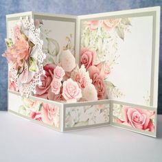 an open card with pink flowers on it