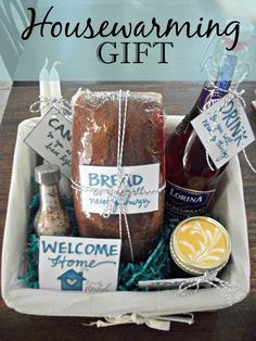 a box filled with bread, jams and condiments for a housewarming gift