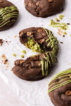 chocolate cookies with green frosting and sprinkles