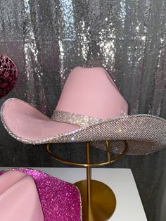 Our pink & crystal hat features our pink hat+ crystal rhinestones on the underneath brim and a matching hat band. Perfect for those who can't get enough of pink! This hat features: Pink straw hat Crystal rhinestones on the underneath brim Matching crystal rhinestone hat band crystal rhinestone trim on edges Sizing: Our pink hats offer sizes S/M and L/XL. We recommend the S/M if you wear a hat size of 7 1/8 or smaller (equivalent to head circumference of 57 CM or 22 1/4 inches). We suggest the L/ Pink Bling Quinceanera Dresses, Diy Barbie Cowboy Hat, Pink Rhinestone Cowboy Hat, Pink Rhinestone Cowgirl Outfits, Pink Tejana, Surprise Dance Outfits Quinceanera Pink, Surprise Dance Outfits Quinceanera