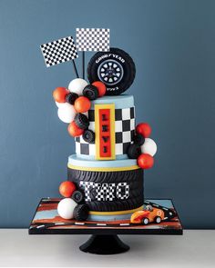 a car themed birthday cake on a table