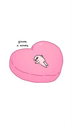 a pink heart shaped pillow with an animal on it's side and the words give me a minute