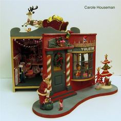 a toy store with christmas decorations on display