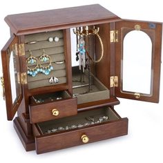 an open wooden jewelry box with many items inside