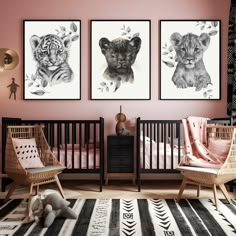 three pictures of animals are hanging on the wall in this baby's nursery room