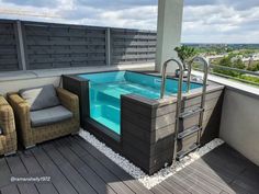 a hot tub sitting on top of a wooden deck