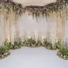 an arrangement of flowers and greenery decorates the entrance to a wedding ceremony venue