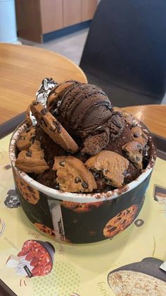 a bowl filled with cookies and ice cream on top of a table