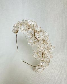 Here is the first piece of our 'Floral Fiesta Collection'!✨ Let spring come to your hair with small handmade flowers :) DESIGN  - All flowers are handmade one by one from gold varnished wire using the UV resin dipping technique and can be moved slightly. - Flowers are white pearl-colored (slightly transparent as can be seen in the photos) and a white glass small pearl was added to the middle of the flowers. - The width of the crown is approximately 6 cm (2,36 inches).  Diameter of flowers (appro Wedding Floral Headpiece, Tiara Floral, Floral Headband Wedding, Tiara Bride, Floral Headpiece Wedding, Bridal Floral Headpiece, Floral Tiara, Bride Floral, Metal Crown