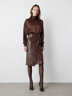 Crafted in buttery soft leather with a draped design, this skirt features a zipper on the back and a front... Brown Leather Pencil Skirt Outfit, Leather Skirt Outfit Work, Dark Brown Skirt Outfit, Brown Leather Skirt Outfit, Long Leather Skirt Outfit, Leather Pencil Skirt Outfit, Brown Ootd, Brown Skirt Outfit, Fav Outfit