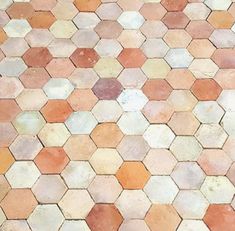 an image of a tiled floor that looks like hexagonal tiles in different colors