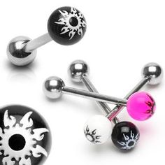 two black and white balls are attached to an ear stud