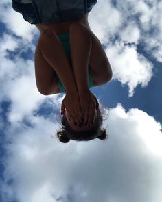 a woman is upside down in the air