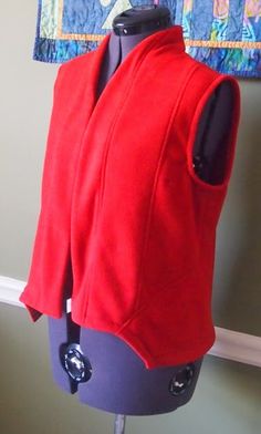 a mannequin with a red jacket on it