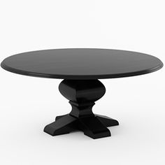 a black round table sitting on top of a white floor