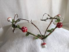 a head piece made out of branches and berries