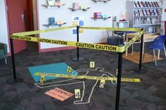 caution tape is taped to the floor in an office