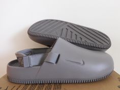 NIKE CALM MULE NA "SANDALS" Features 100% AUTHENTIC BRAND NEW IN OPEN TOP BOX. COLOR: FLAT PEWTER-FLAT PEWTER Equipped with extra cushioning in the ankle area Sleek design that works on the street as well as on the ramp Size & Style Info SIZE 14 US MENS INTERNATIONAL SIZES: (13 UK)  (48.5 EU)  (32 CM) Style # FD5130 004 Shipping We ship within 1-2 business days (excludes Saturday, Sunday, and holidays) from receipt of payment We do ship to APO/FPO and Post Office box addresses We do ship to Alaska and Hawaii Tracking will be sent for all purchases within 24-48 hours Payment We accept payment by PayPal and credit card through PayPal Immediate payment is required Returns We offer a 30 day (after payment) 100% money back guarantee. Buyer pays return shipping All items MUST be in the original Nike Products, Grey Sandals, Mens Shoes Sandals, Pewter Grey, Saturday Sunday, Box Color, Open Top, Post Office, Sleek Design