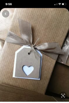 a brown package with a heart tag tied to it