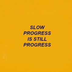 the words slow progress is still progress written in black on a yellow background