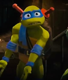 the teenage mutant from teenage mutant is dressed in yellow and blue