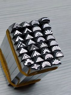 a black and white object sitting on top of a wooden table