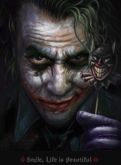 the joker is holding a knife in his right hand and looking down at it's face