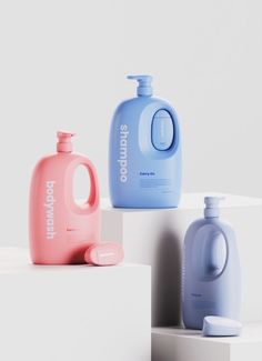 three different types of bottles sitting on top of each other in front of a white wall