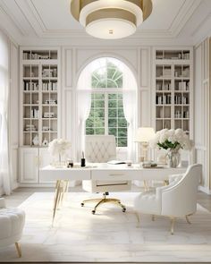 an elegant white home office with lots of bookcases and furniture in the room