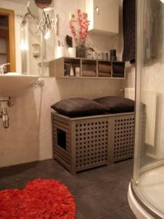 an image of a bathroom setting with red rugs