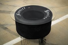 a small black table with writing on it