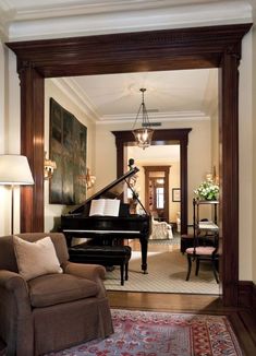 a living room with a grand piano in it