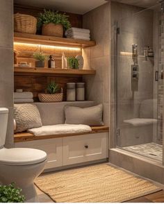 a bathroom with a toilet, shower and shelves in the wall above it that have plants on them