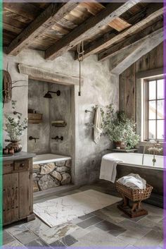 a rustic bathroom with stone walls and flooring is featured in this image, along with a large bathtub