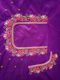 an embroidered purple cloth with pink flowers on it