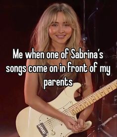 a woman holding a guitar with the caption me when one of sarina's songs come in front of my parents