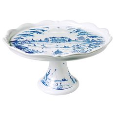 a blue and white cake plate sitting on top of a table