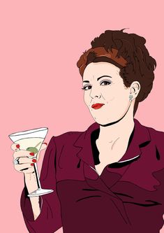 a woman holding a martini glass in her hand