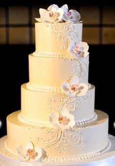 a wedding cake with white flowers on top is shown in an instagram post for the bride and groom