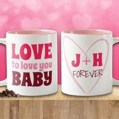 two coffee mugs with the words love to love you baby and j + h forever