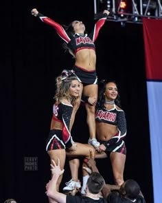 the cheerleaders are doing tricks on the stage