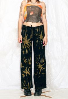 Y2K vintage trousers - these wide-leg, hand-painted flares are here to remind you that the early 2000s were an absolute fashion rollercoaster! We used industrial-quality textile paint which is machine washable. Features: - four pockets - zip closure - 100% cotton - reworked Every item we manage is cleaned and, when necessary, repaired, ensuring it arrives to you in top condition. Our model, Szedi is 170 cm / 66.3" tall and she's a size L. Size: L / US 8 / UK 12 / IT 44 Measurements:  waist (seam to seam): 46 cm / 17.9" rise: 26 cm / 10.1" inseam length: 77 cm / 30.0" Fabric: cotton 100% Care: Machine wash inside out Textile Paint, Vintage Trousers, Womens Trousers, Pants Vintage, The Early 2000s, Womens Pants, Vintage Pants, Pantalon Large, Black Hand