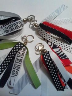 several different colored lanyards with black and white designs